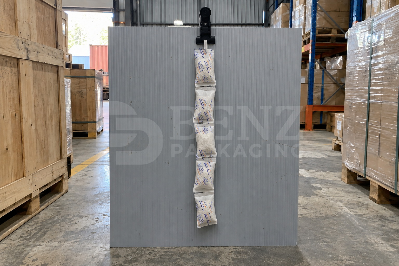 BE DRY ULTRA calcium chloride container desiccant secured at an upper lashing point beside dry cargo