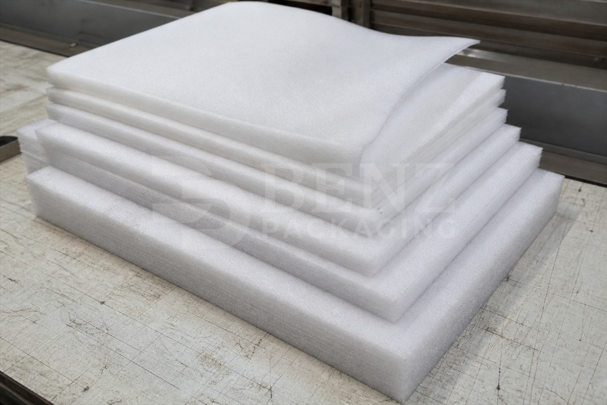 foam sheets cut at a packaging workbench