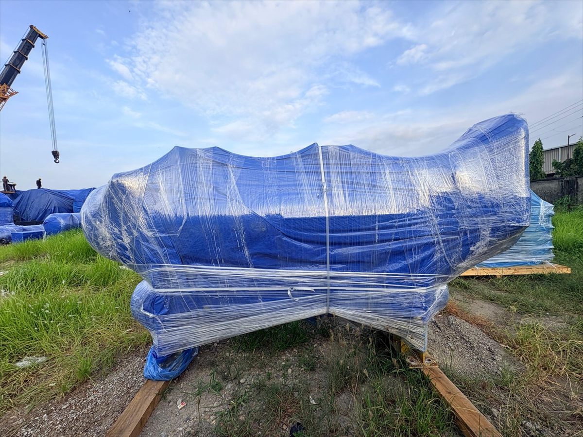 Long format equipment shrink wrapped end to end and supported along its length, Bangalore