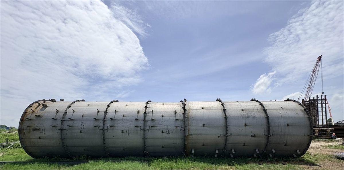 Fabricated pressure vessel shell in the laydown yard before preservation wrapping
