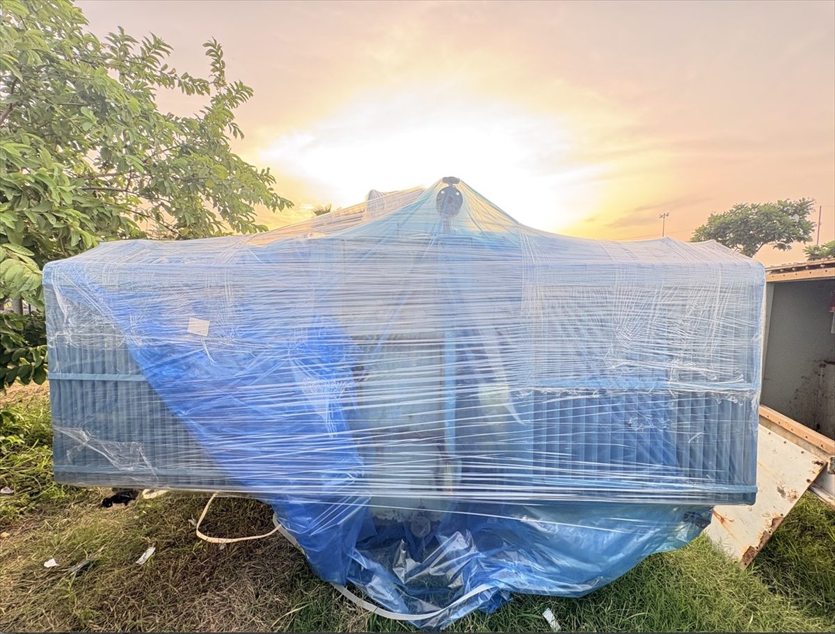 Machinery shrink wrapped and sealed for open yard storage