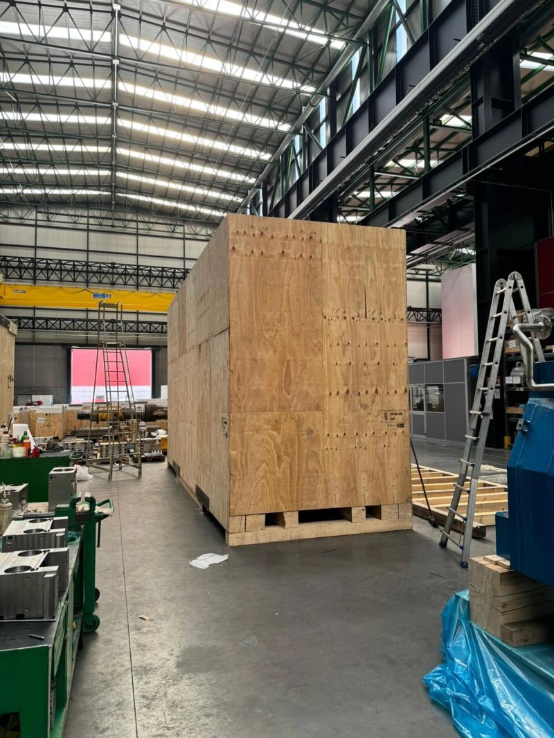 Finished heavy machine export crate mounted on skids in BENZ warehouse
