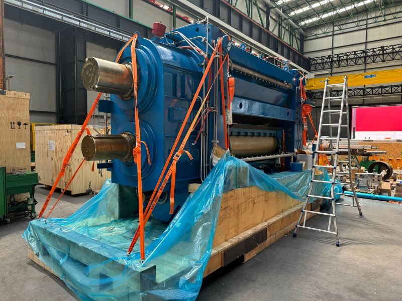 BENZ engineers wrapping a rolling mill machine in VCI film before crating for export