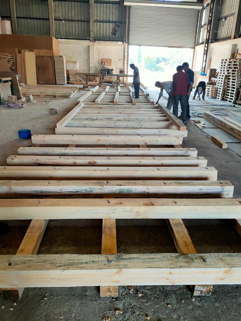 BENZ team fabricating heavy duty timber skid bases for machinery export crating