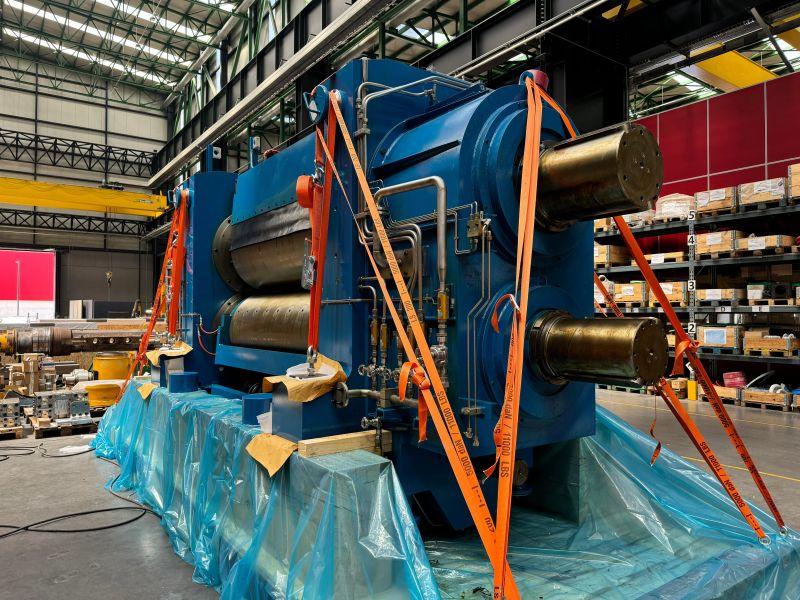Heavy rolling mill lashed to an engineered timber skid under protective sheeting for export by BENZ Packaging