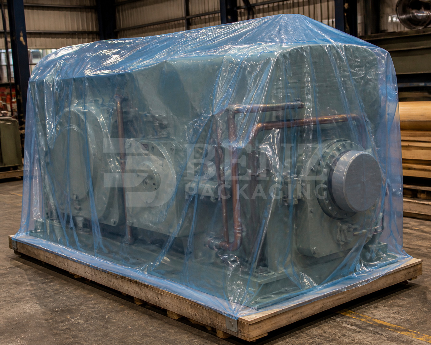 Multimetal VCI film packaging for a large paper machine gearbox in an industrial parts-protection scenario.