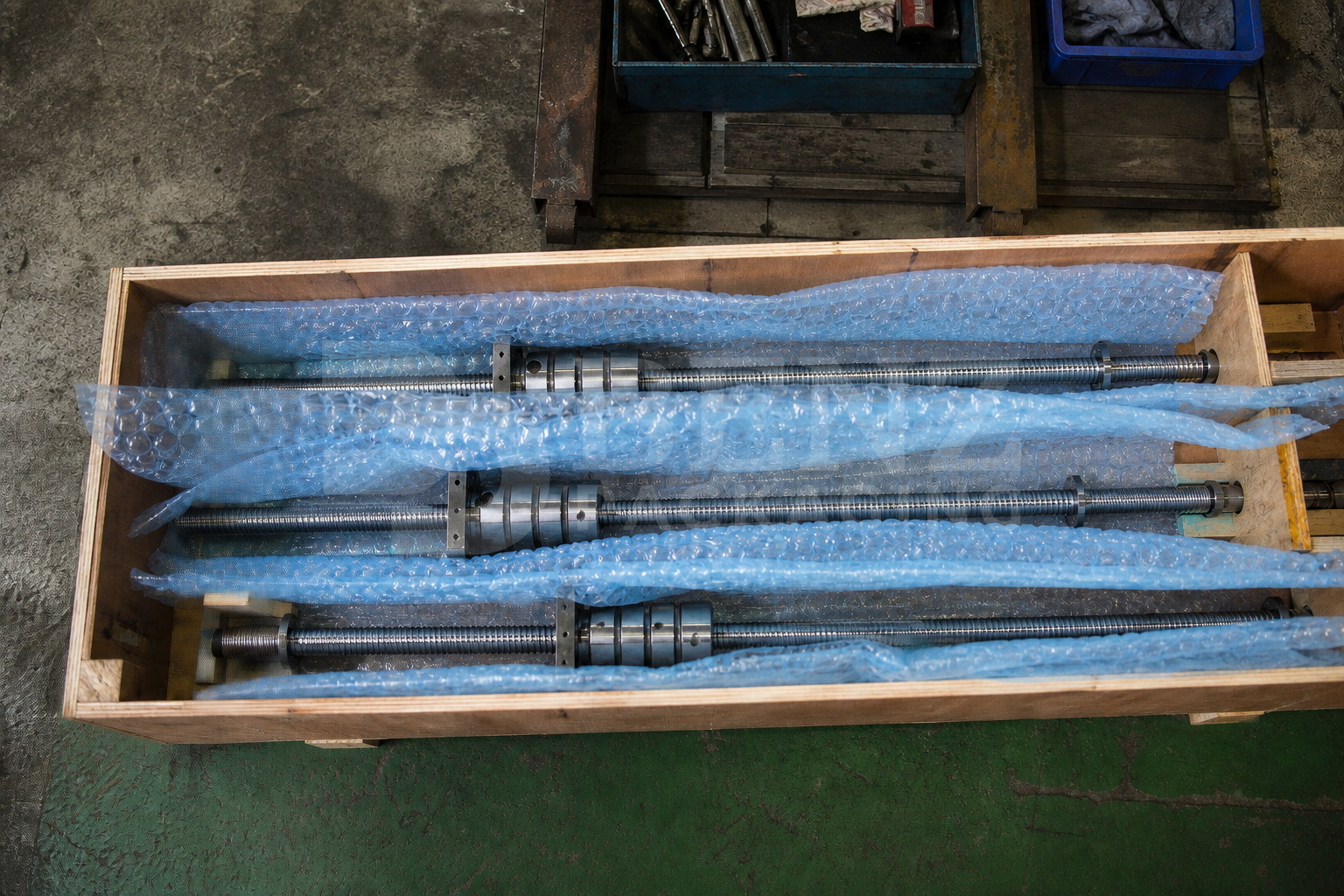 VCI bubble film cushioning machine tool ball screws in an industrial protective pack.