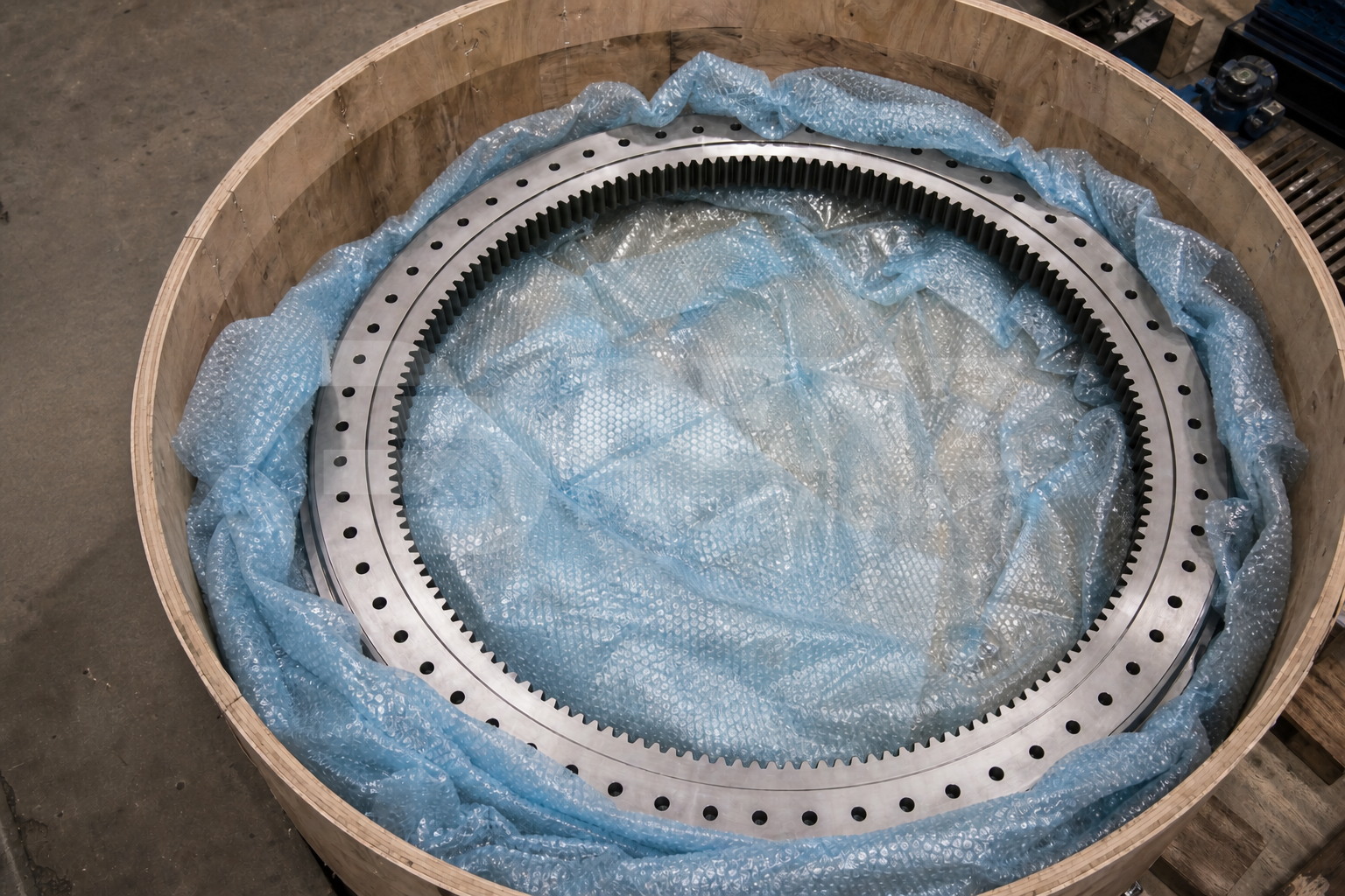 VCI bubble film cushioning a large slewing bearing in an industrial protective pack.