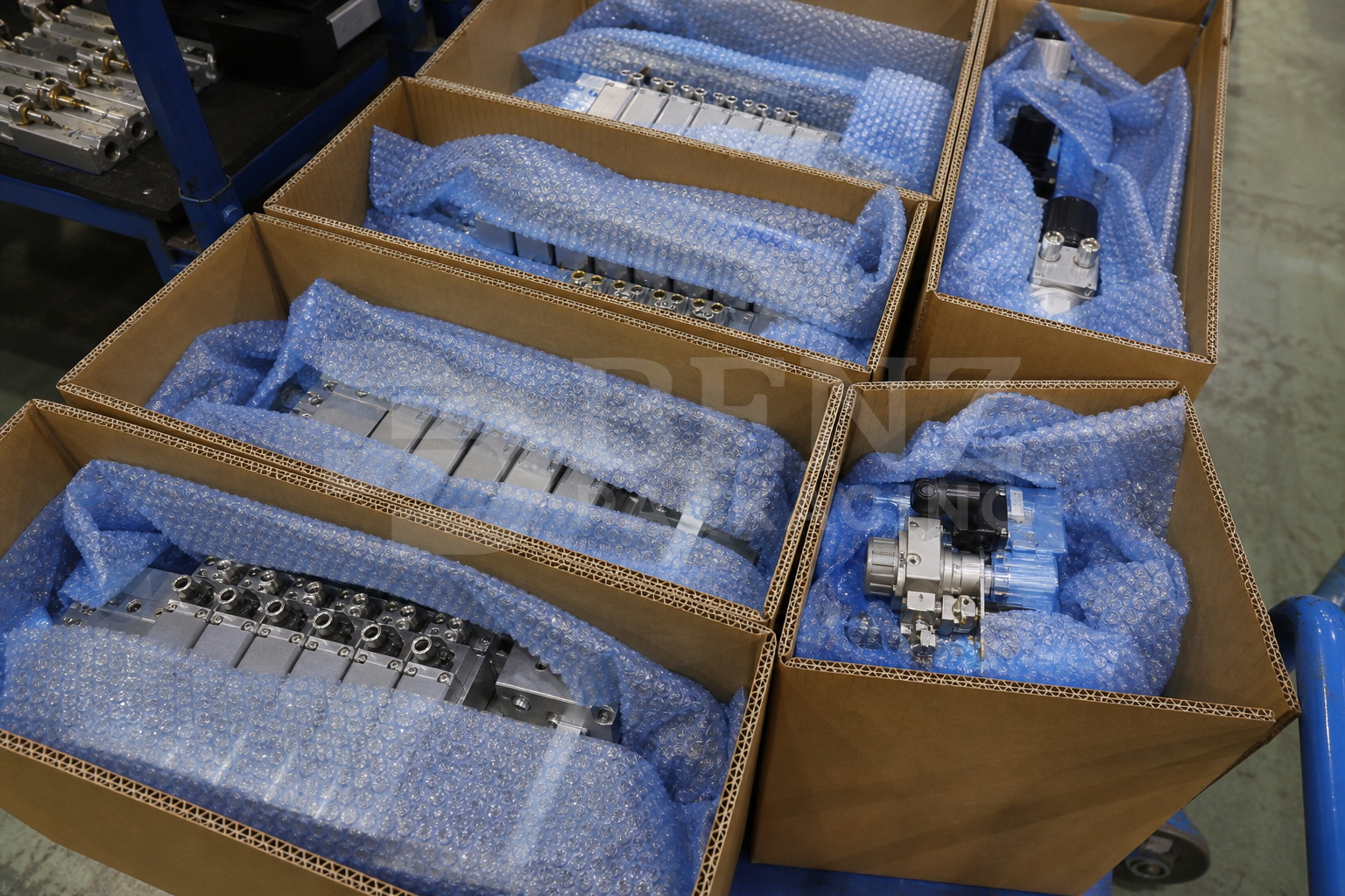 VCI bubble film cushioning pneumatic valve islands in an industrial protective pack.